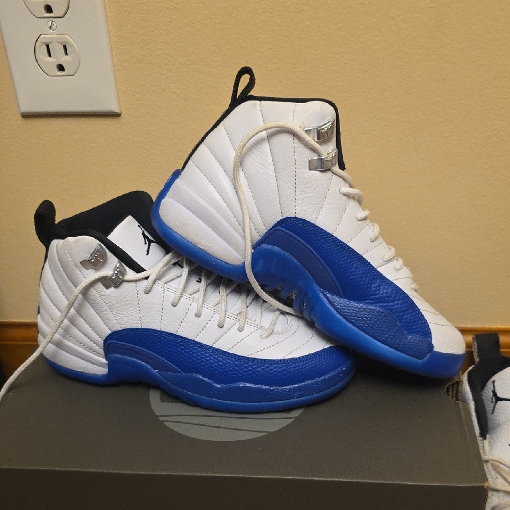 Jordan 12 Retro White and Blue Sneakers.